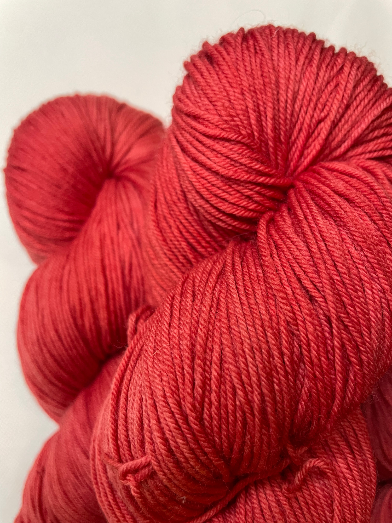 Maple Red hand-dyed yarn skein, lighter bright red